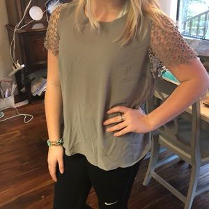 Grey shirt with circle sleeve detailing